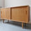 Thumbnail: Oak sideboard with sliding doors by Carlo Jensen for Hundevad & Co