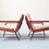 Thumbnail: Pair of mid-century Danish teak lounge chairs with metal legs