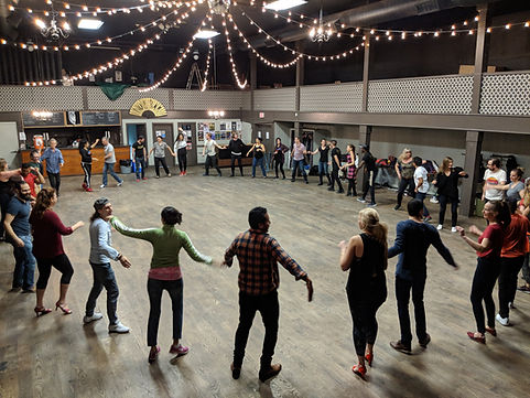 Students in Julio Montero's dance class at Ukrainian Hall forming a circle and dancing the Rueda de Casino