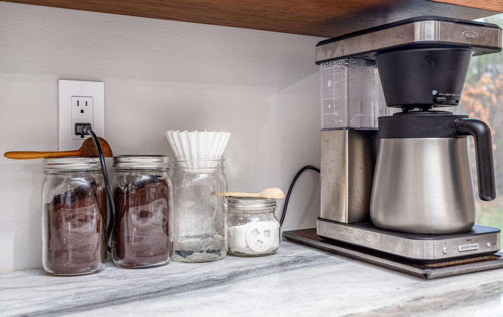 Coffee maker with glass jars of coffee grounds in Andover, MA