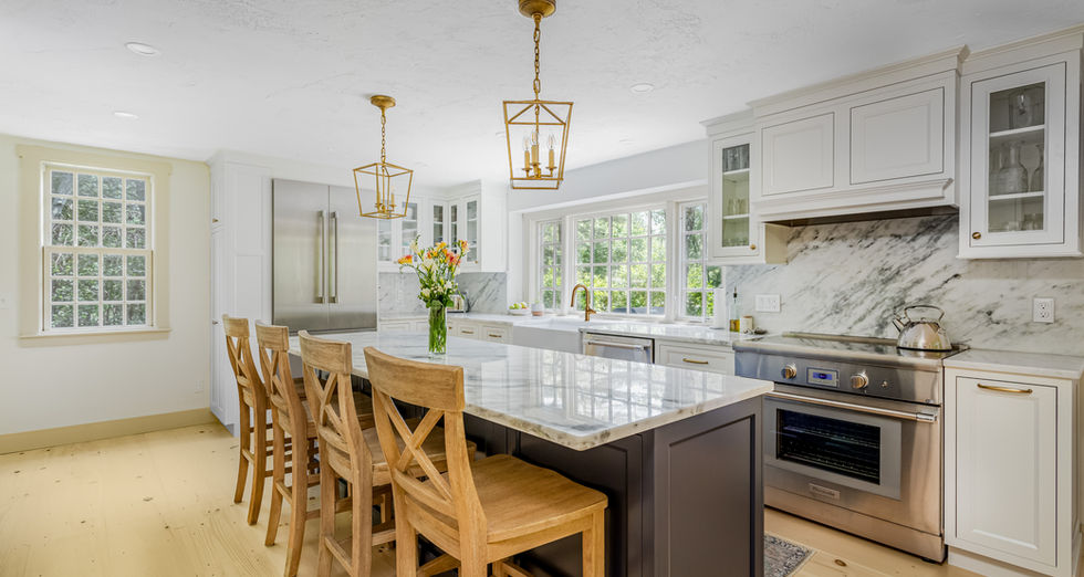 Modern kitchen at Century Mill Rd in Bolton with marble island.