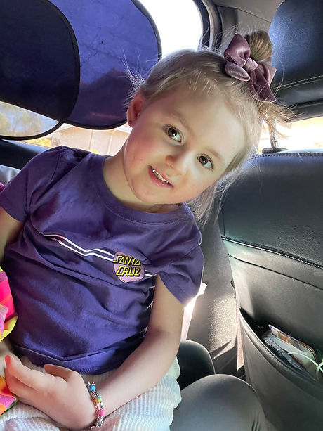 water tragedy survivor Stella wearing purple sitting in the car