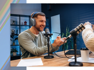 Podcast host laughing and engaging with guest, showing the authentic connections that build listener trust and brand credibility.