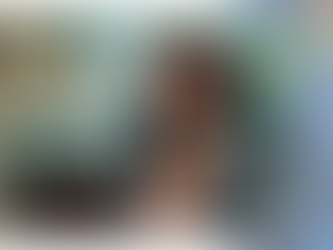 Podcast host wearing headphones over curly hair, symbolizing the rich diversity within the podcast space in 2025.