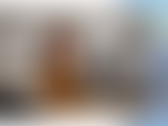 Smiling podcast host, representing the success and benefits of authentic connections and long-term brand partnerships through podcast collaborations.