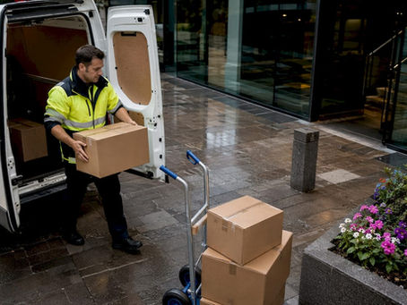 Courier loading van for same-day delivery in Aberdeen