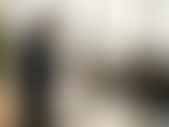 Courier delivering package at busy UK office