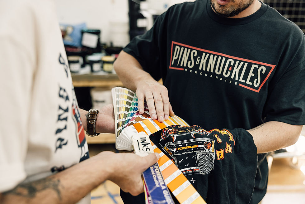 Pins & Knuckles staff matching pantone colours to screen printed shirt