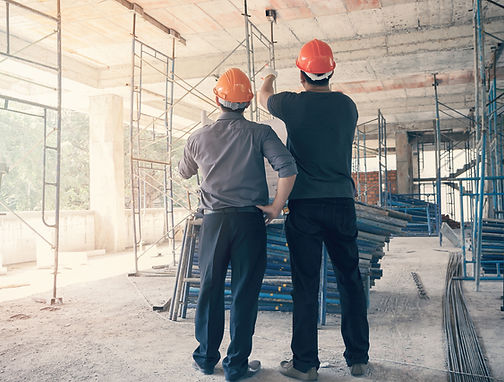 Contractors inspecting construction site – part of project covered by BPI construction insurance