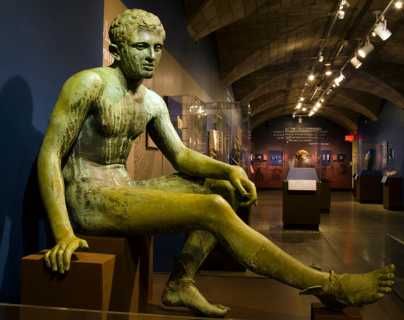 Statue (Reproduction) of Seated Hermes commissioned by John Wanamaker from the J. Chiurazzi and Fils foundry on display in the Penn Museum - AurelianusPoliorcetes, CC BY-SA 4.0, via Wikimedia Commons