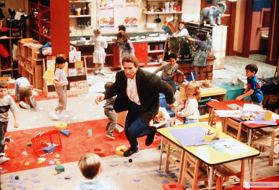man running away from small children in a classroom