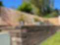 Beautifully Weathered Azobe Tropical Hardwood Reclaimed Sleepers with Planed Larch Fencing.jpeg
