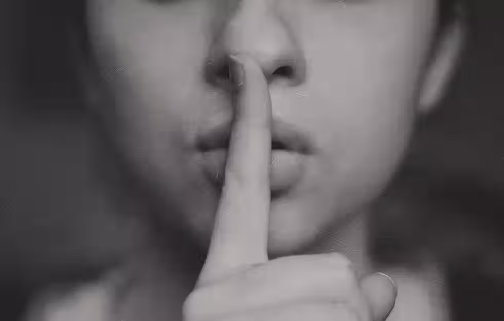 Woman shushing lips