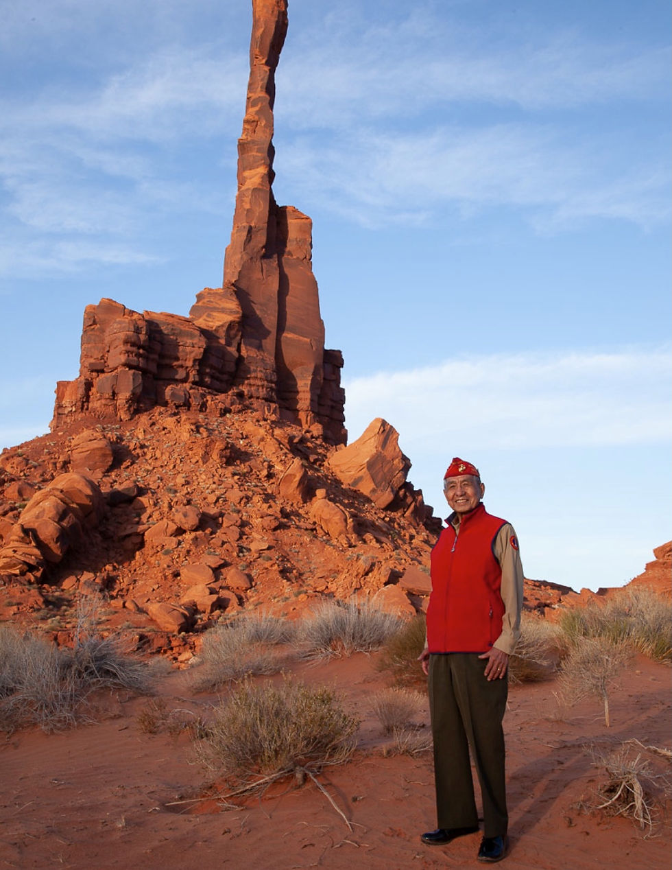 Photo of USMC Navajo Code Talker, World War II, Peter MacDonald, Sr. in Monument Valley near Totem Pole Yei Be Chei area. He is standing in his relaxed uniform and Garrison Cap.