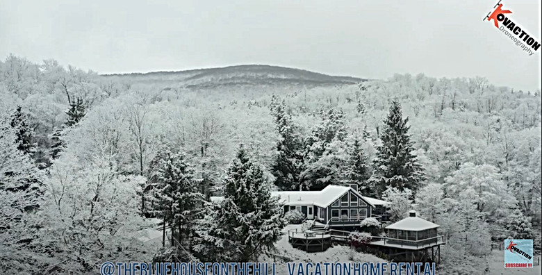The Blue House in the Snow