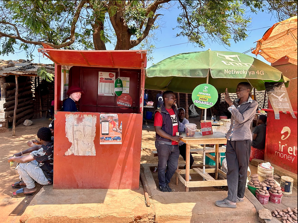 Since 2023, Maureen Kamatu, 28, has been self-employed at a mobile money cash-transfer booth in Lilongwe. When she first started the business, she faced open discrimination from customers and neighboring vendors. “Passersby often said derogatory things about me as a person with albinism. I heard things like, ‘Is she going to be able to see well? Is she going to be able to count the money? Are you sure she can do this job?’” © 2025 Samer Muscati/Human Rights Watch