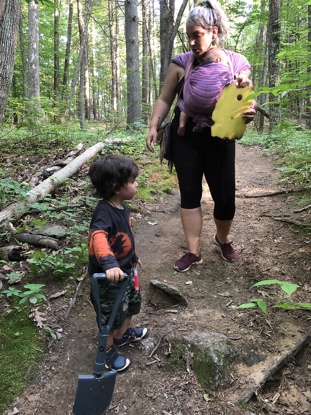 A forest scene with a mother and her children.