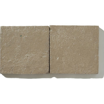 Handmade semi-matte terracotta tile in warm ochre tone with natural clay texture