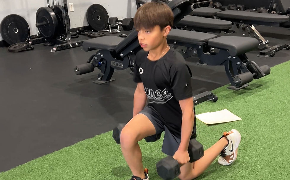 youth athlete performing dumbbell lunge exercise
