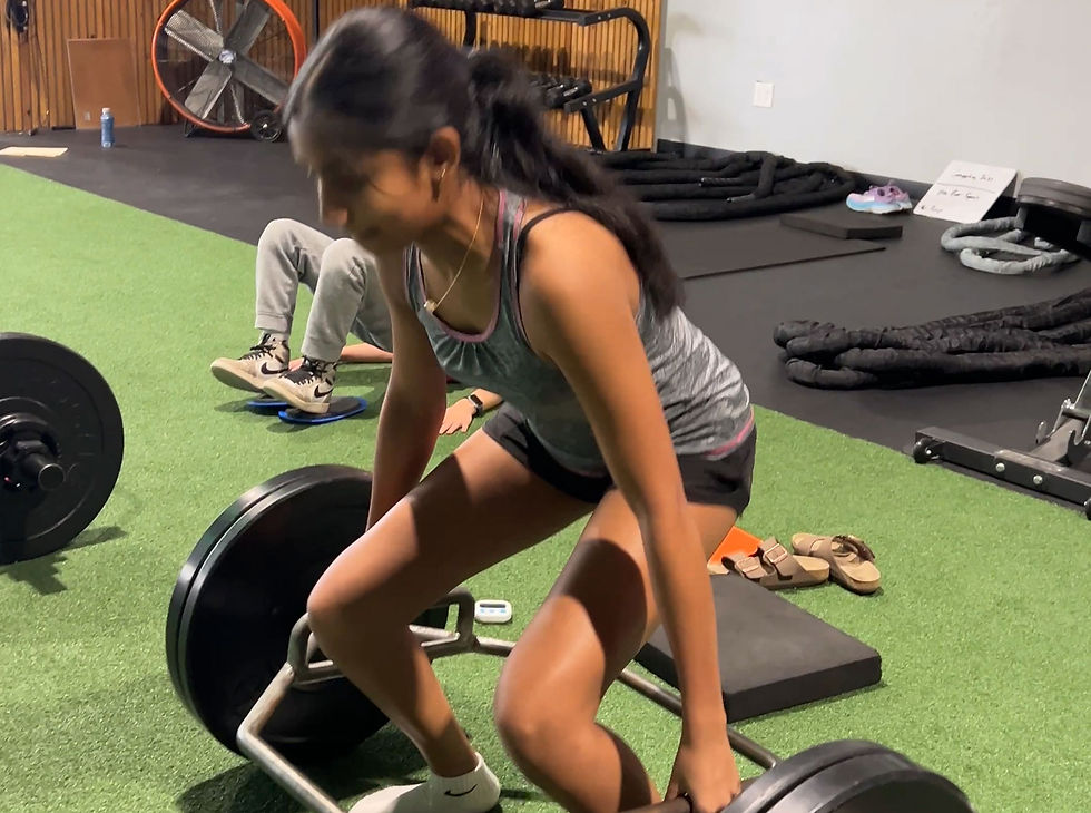 youth athlete performing trap bar deadlift
