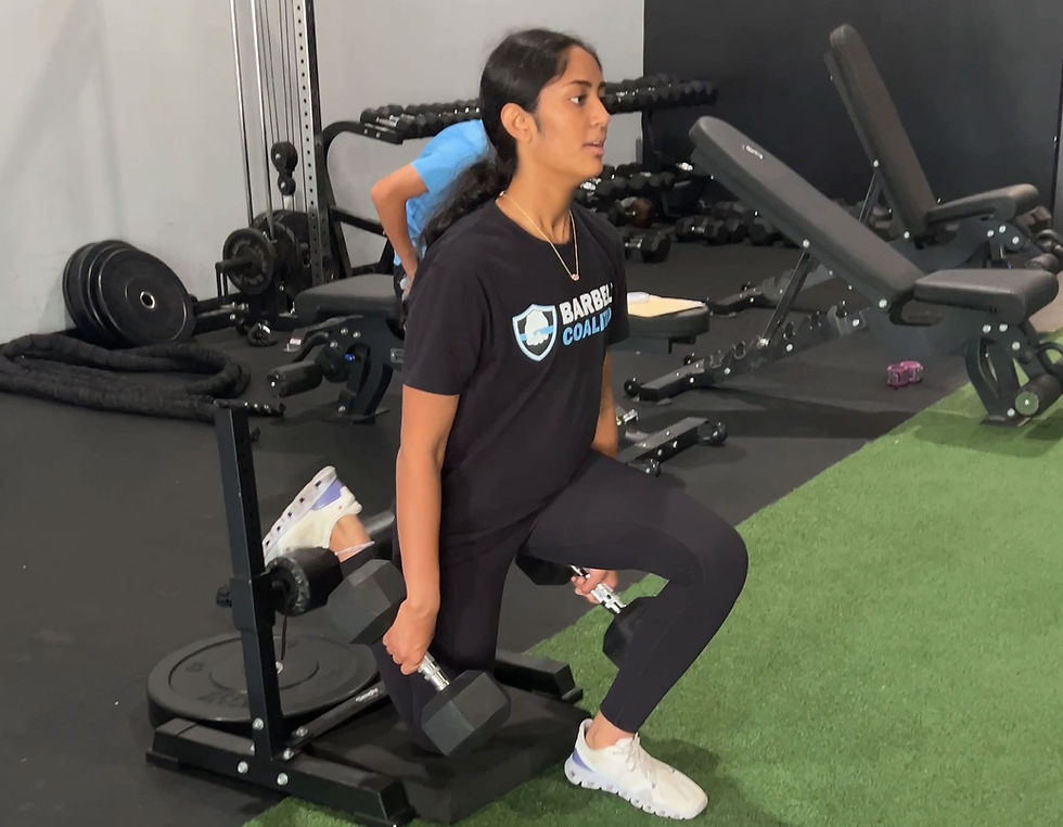 high school athlete performing strength exercise at Barbell Coalition