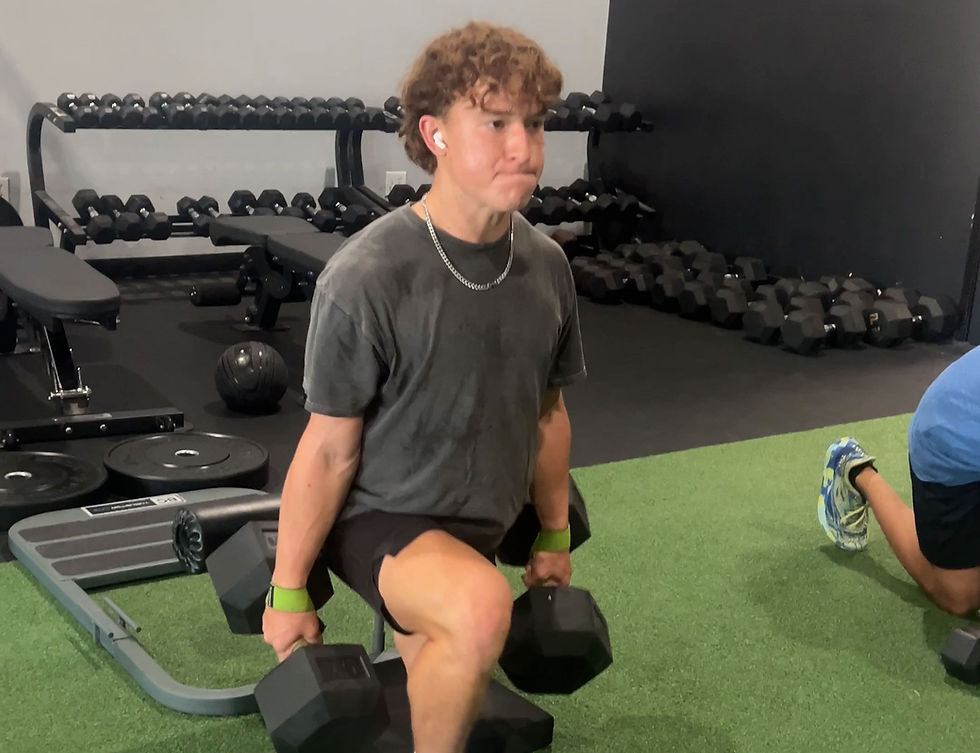 cedar park high school athlete performing dumbbell exercise