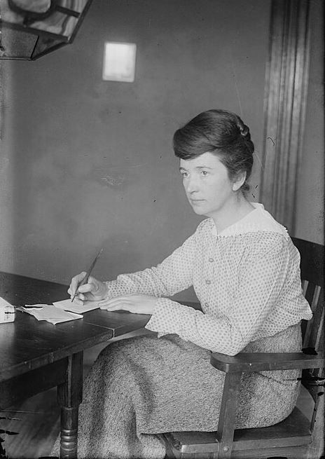Margaret Sanger Sitting at Table Writing