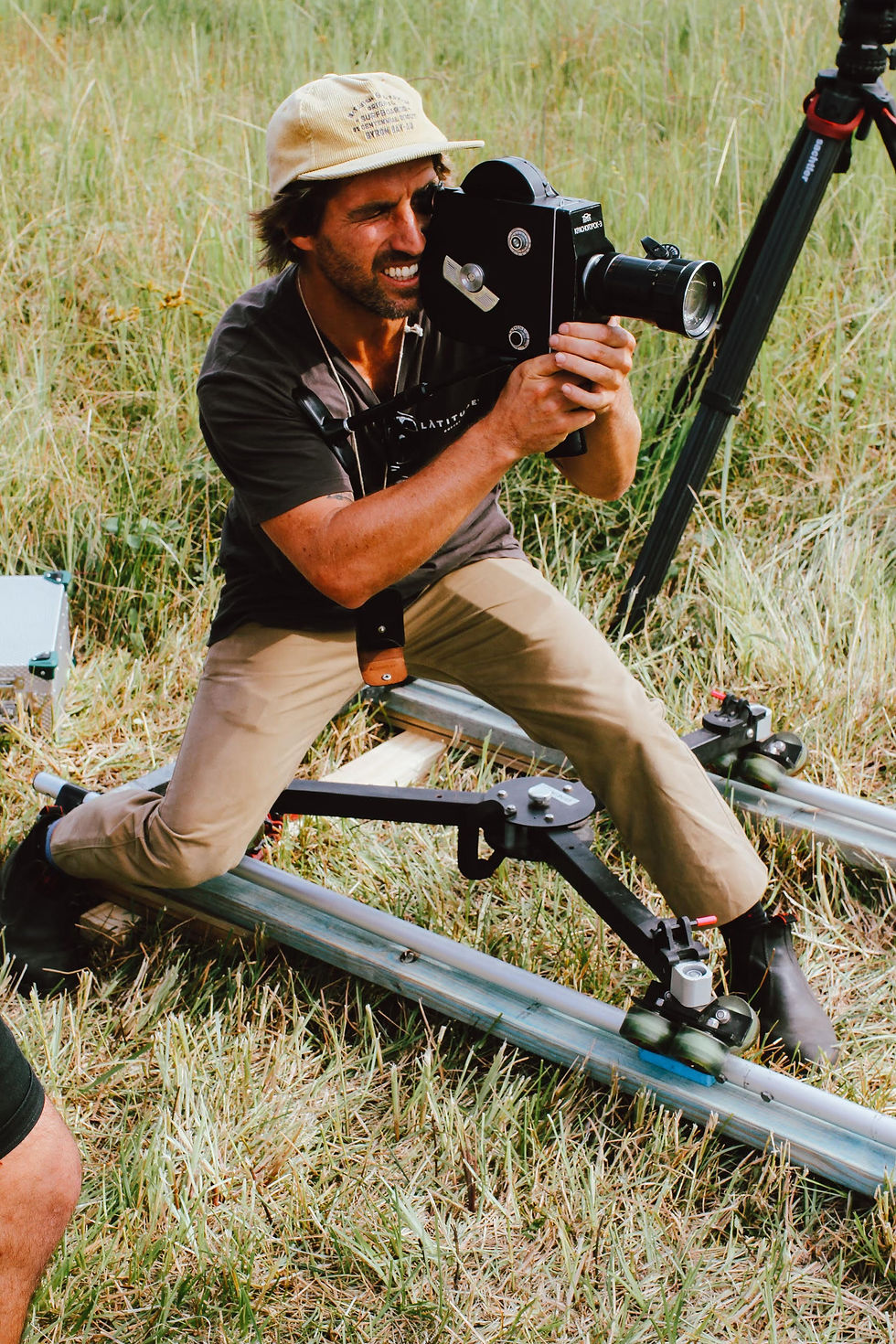 Eye-level view of vintage 16mm camera on tripod in studio