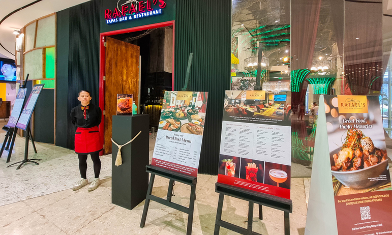 Rafael's Tapas Bar and Restaurant entrance with staff and menus