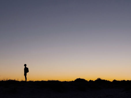 Person reflecting quietly, representing the emotional weight of trauma and C-PTSD