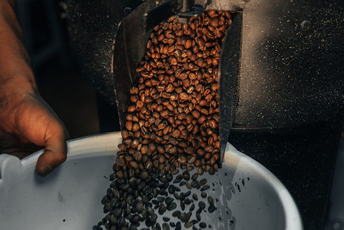 Coffee Beans leaving a Coffee Roaster