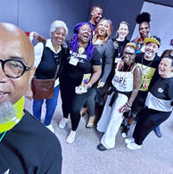 Diverse group of smiling people at a welcome event