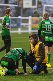 Jaiden Miller pitchside first aid attending injured player