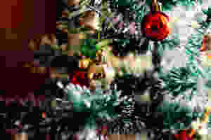 A Christmas tree with red and gold decorations.