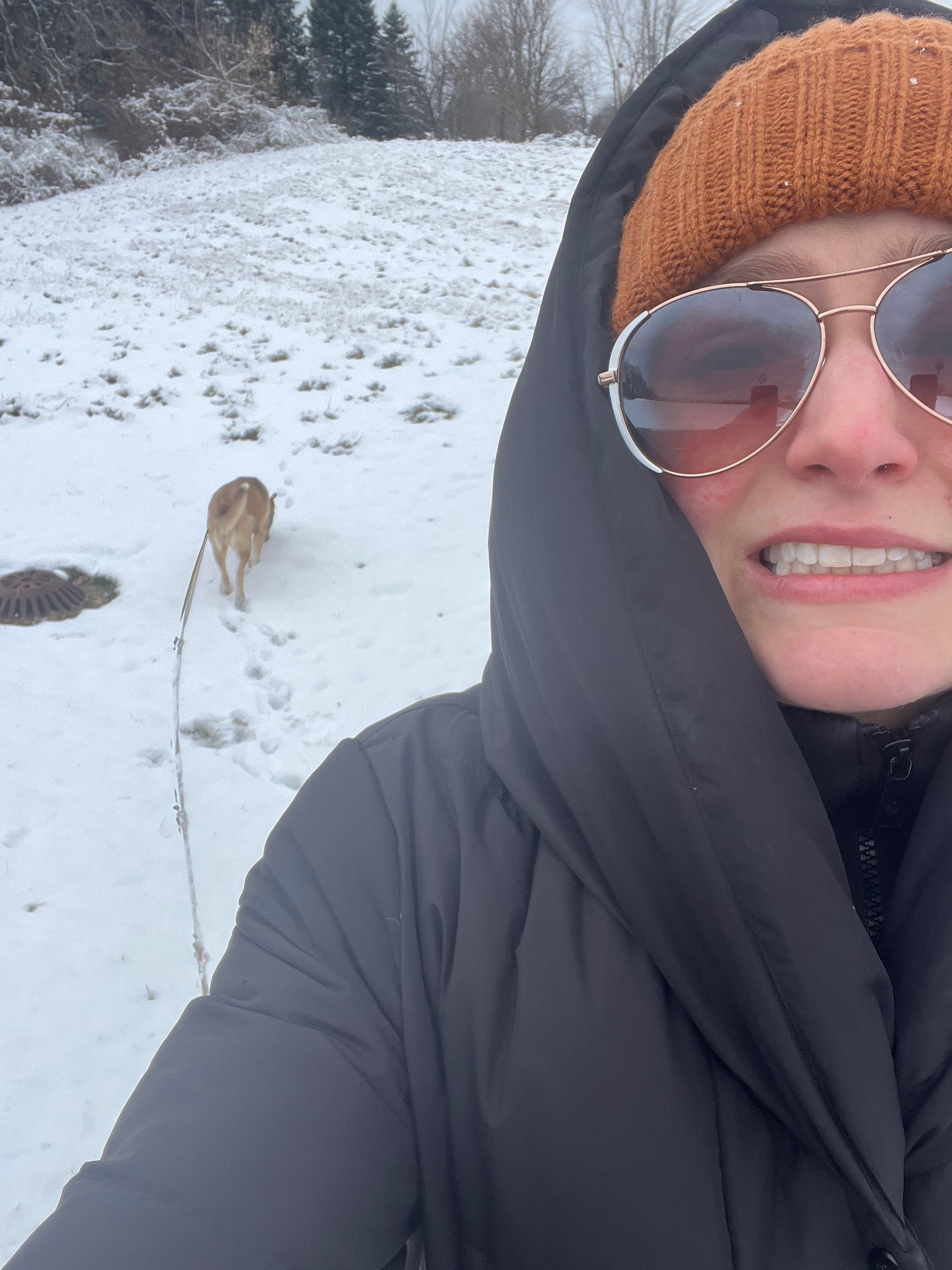 Lauren Figueroa poses for a cold selfie while on a snowy walk with her dog Ruby