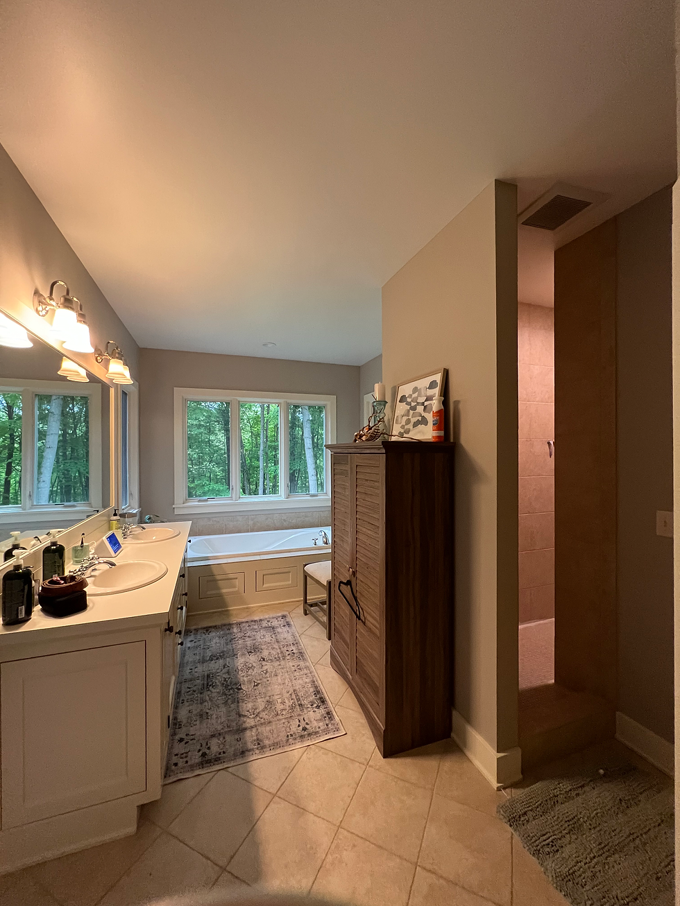 a "before" image of a primary bathroom suite belonging to an interior design client