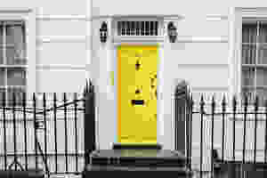 A front door painted bright yellow.