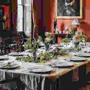 An image of an elegant dining room table set with from dinnerware.