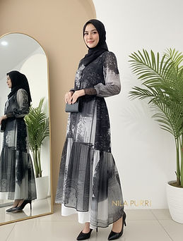 This black ethnic patterned long dress is made from a lightweight, flowy fabric that creat