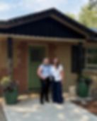 New homeowners with their new house