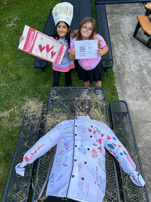Girls preparing scarecrow