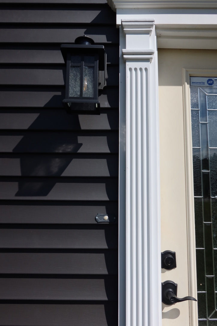 New entry door and vinyl siding trim installed in East Providence Rhode Island.