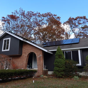Front view of home with board and batten siding installed by a siding contractor in Central Falls Rhode Island.