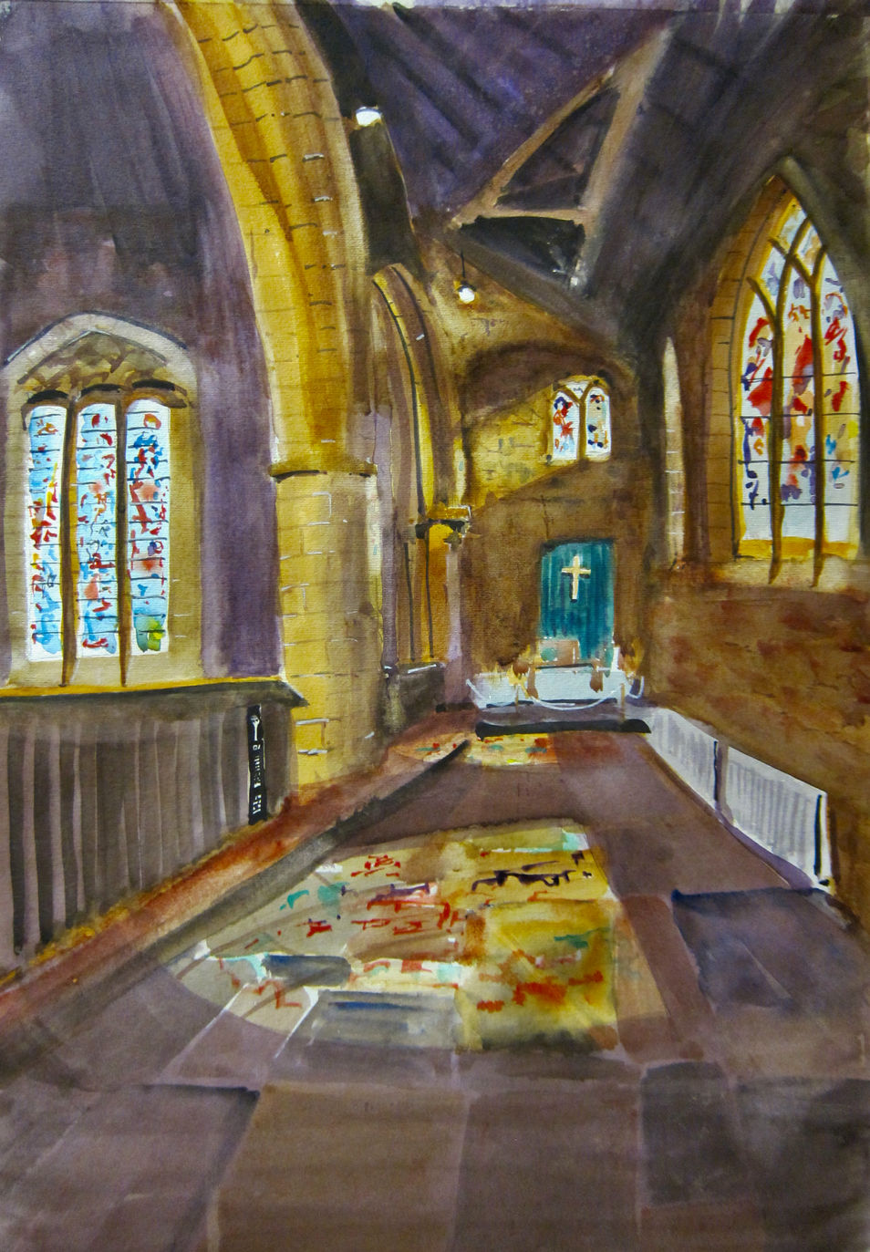 Inside church with light from stained glass windows.