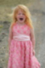 Young child showing haircut anxiety before salon appointment