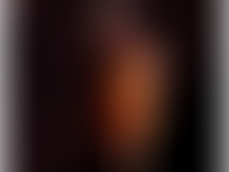 Warm flame of light in darkness, symbolizing Alex the AI intimacy coach
