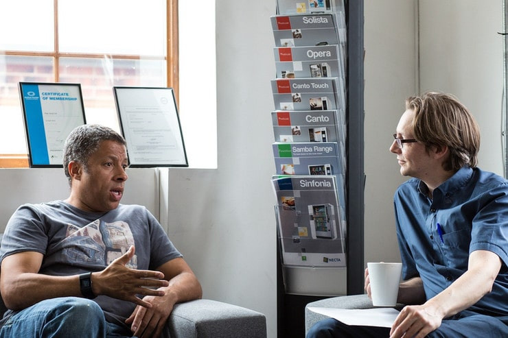 Two people having a conversation, listening to one another