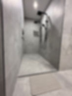 Modern shower rebuild with grey tiles and black fixtures Apex Shower Repairs