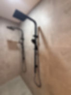 Modern shower rebuild with black fixtures and regrouting Apex Shower Repairs