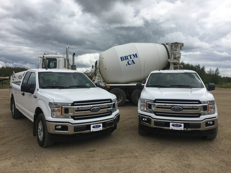 white concrete trucks